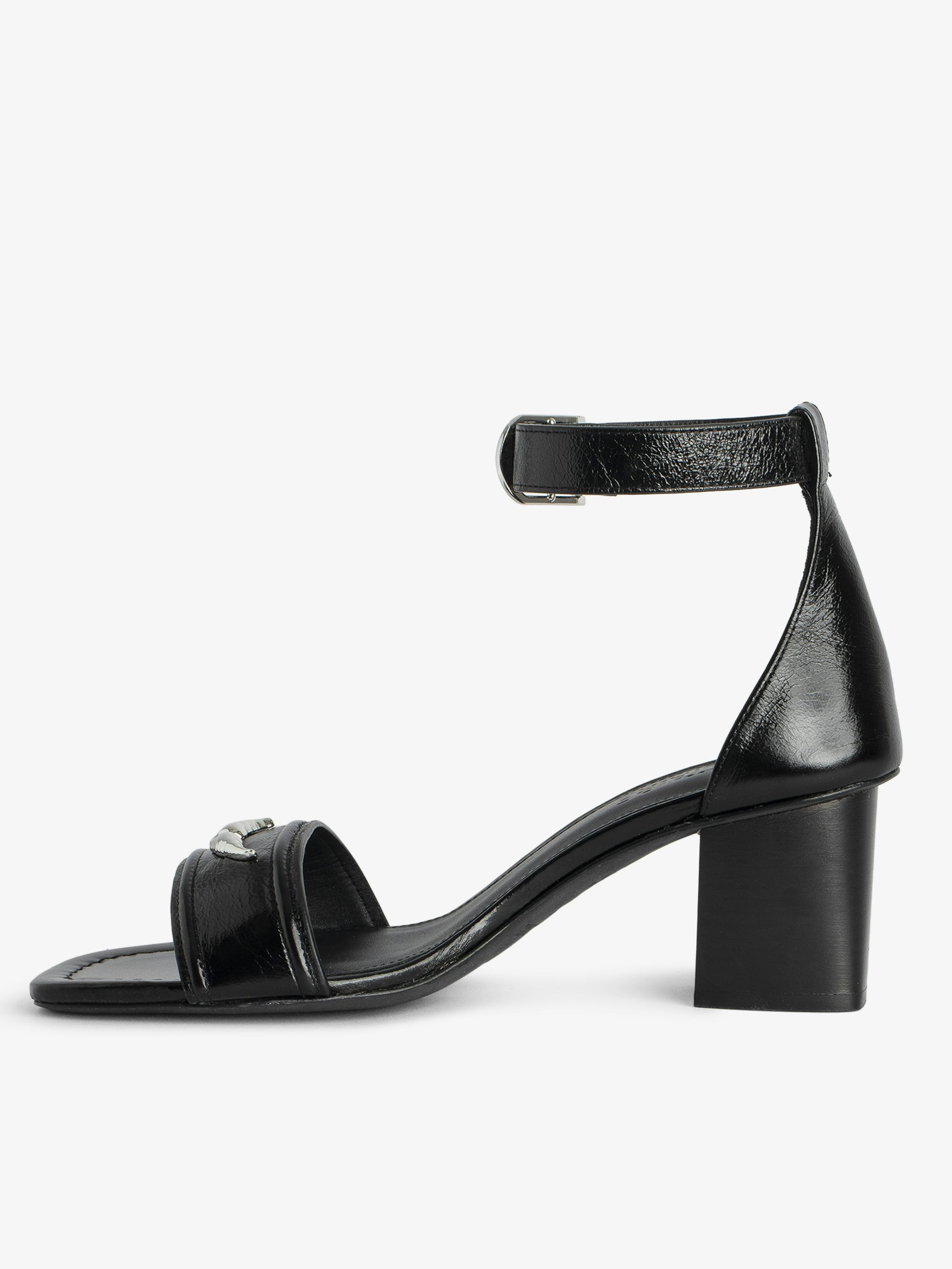 Caprese Sandals - Heeled sandals with leather strap adorned with a wing charm and a signature buckle.